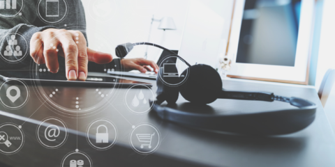 Contact center headset hand on tablet technology overlay